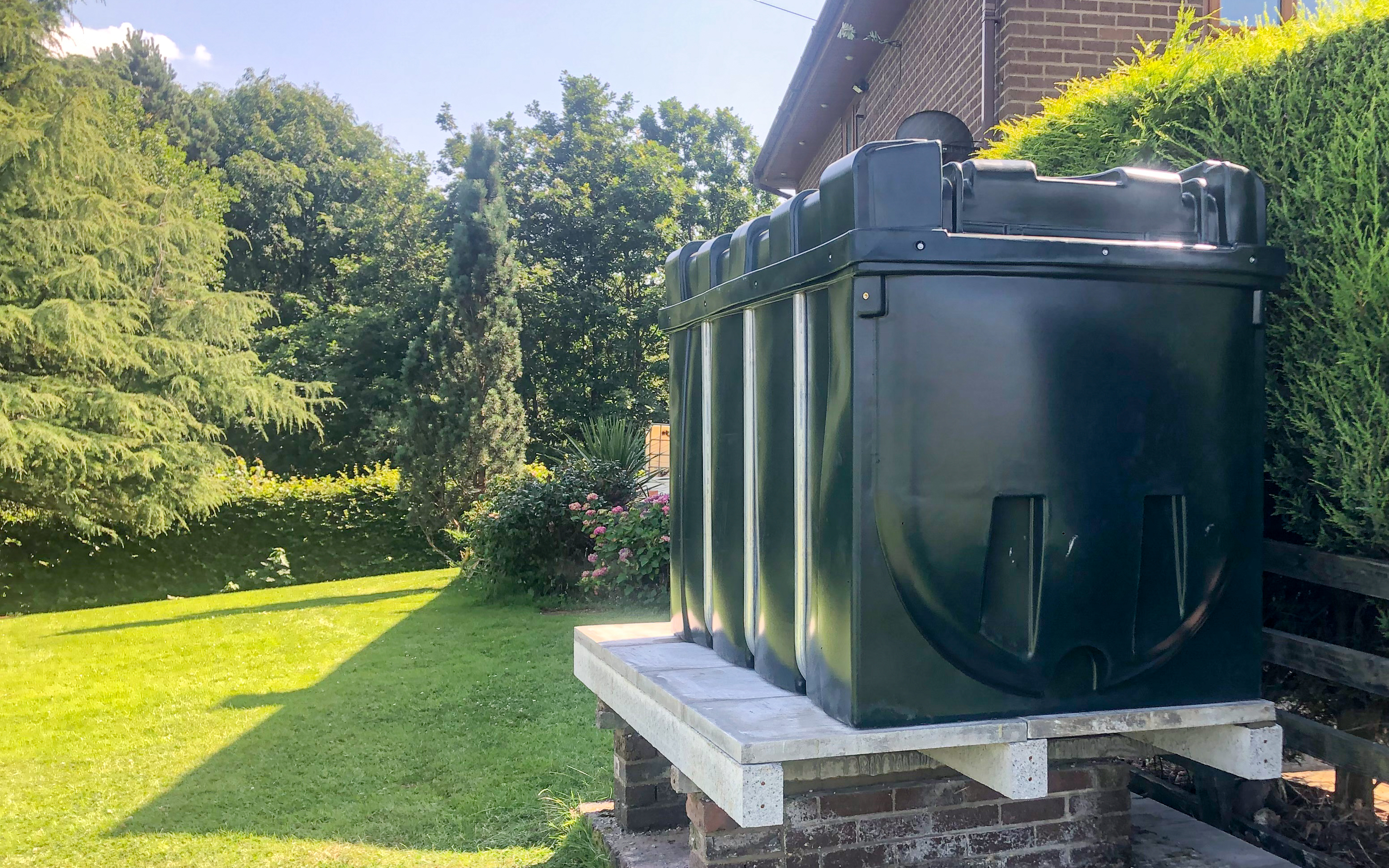 Heating Oil tank in a customers garden during sunny weather.