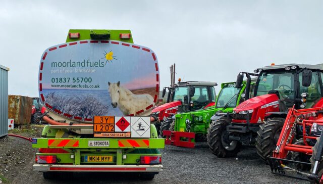 A Moorland Fuels tanker at a farm yard showing various tractors